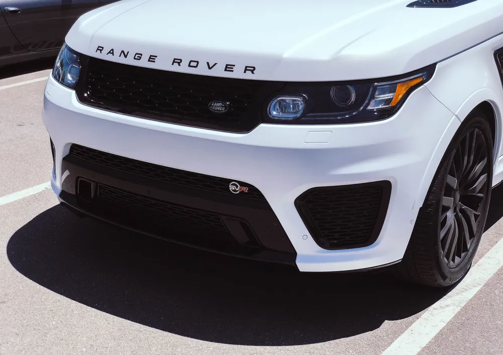 White Range Rover Sport SVR blackout — black grille, letters and trim by Vaderwerks