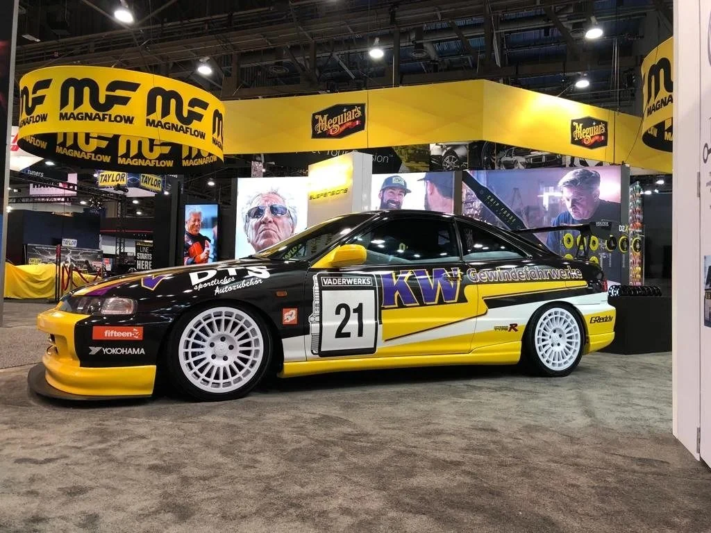 Black and yellow KW Honda race livery number 21 at SEMA by Vaderwerks
