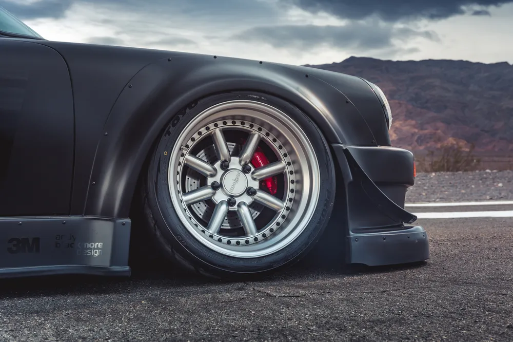 Porsche 911 RWB front wheel and widebody fender close-up